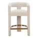 Beige bar stool with a gold metal base on a white background