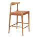 Wooden bar stool with woven seat on a white background