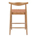 Wooden bar stool with woven backrest on a white background