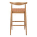 Wooden bar stool with woven seat on a white background