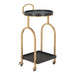 Two-tiered serving cart with gold frame and black trays on a white background