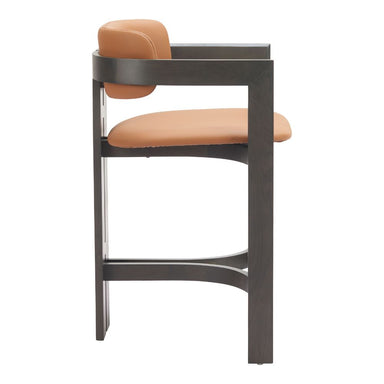 Bar stool with brown cushioned seat and backrest on a white background