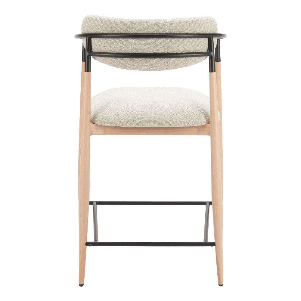Bar stool with beige cushioned seat and backrest on a white background