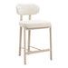 Beige bar stool with cushioned seat and backrest on a white background