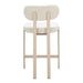 Beige bar stool with white cushioned seat on a white background