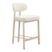 Beige bar stool with white cushioned seat and backrest on a white background