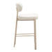 Beige bar stool with white cushioned seat on a white background