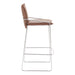 Bar stool with brown leather seat and metal frame on a white background