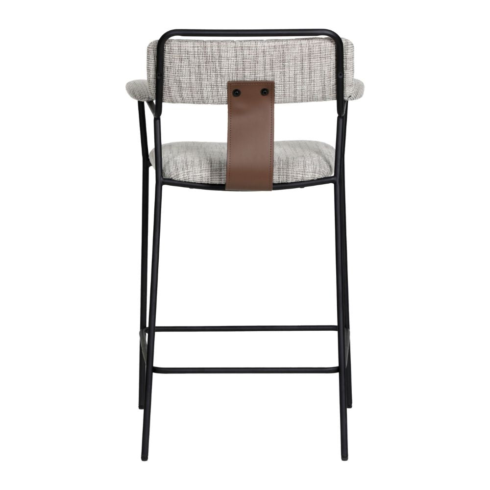 Bar stool with black metal frame, gray cushioned seat, and brown leather strap on a white background