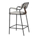 Bar stool with black metal frame and gray cushioned seat on a white background
