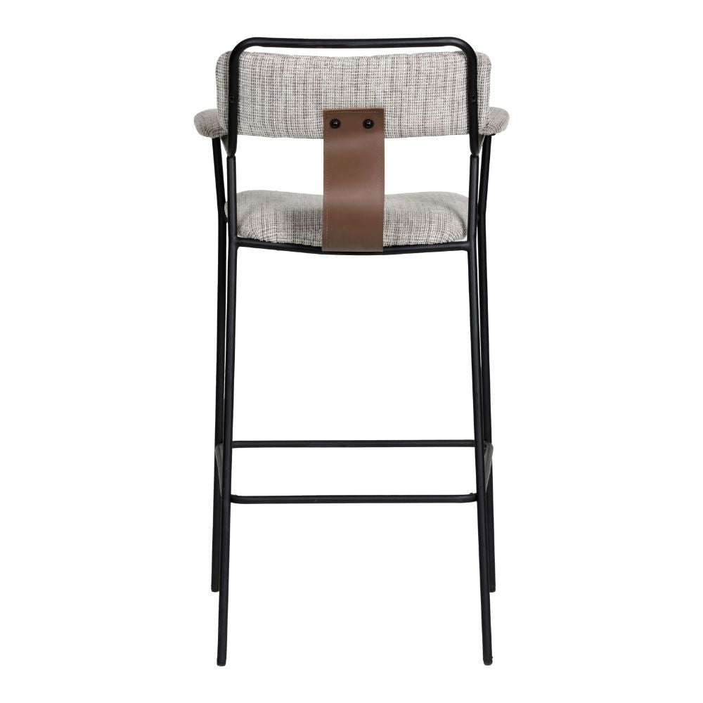 Bar stool with black metal frame, gray cushioned seat, and brown leather strap on a white background