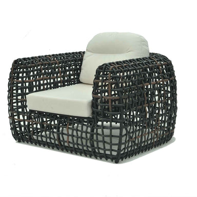 Wicker chair with white cushion on a white background