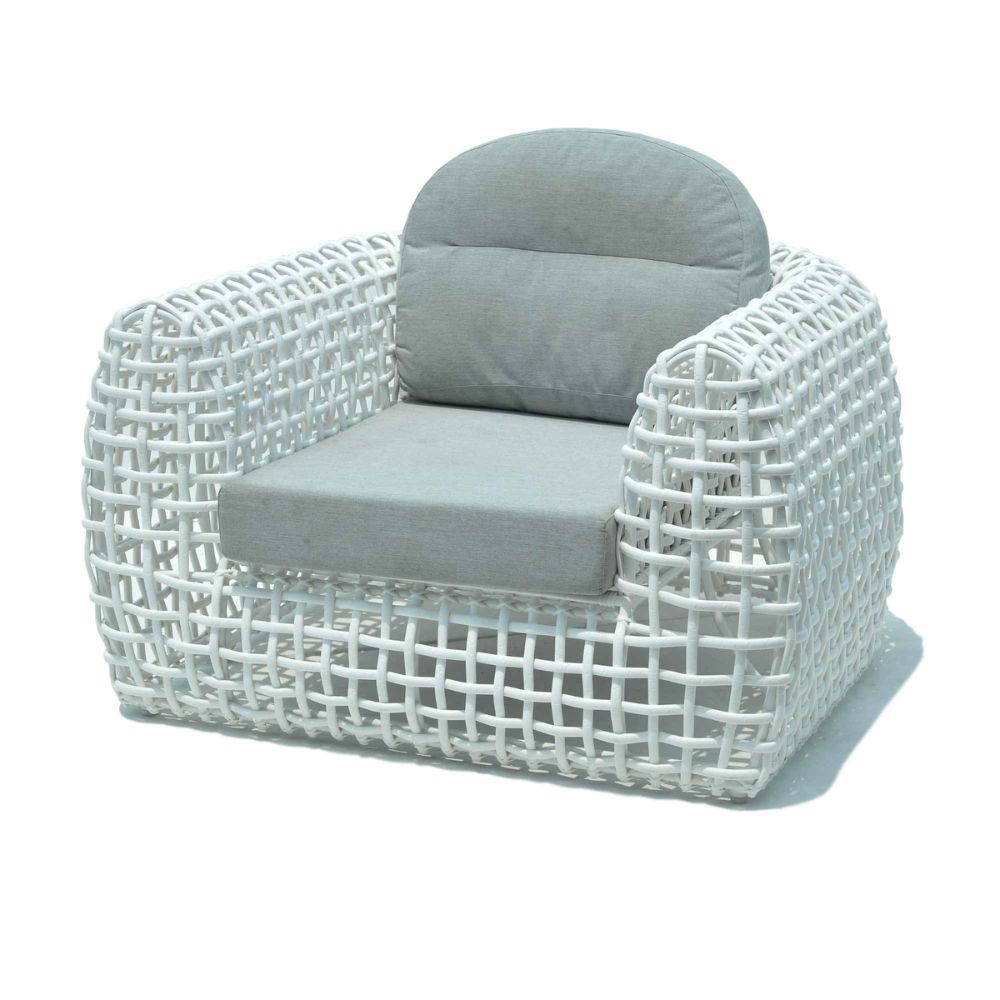White wicker armchair with gray cushions on a white background