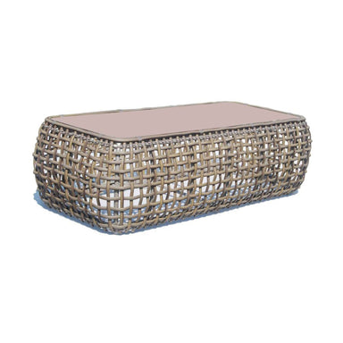Woven coffee table with a glass top on a white background