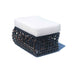 Woven ottoman with a white cushion on a white background