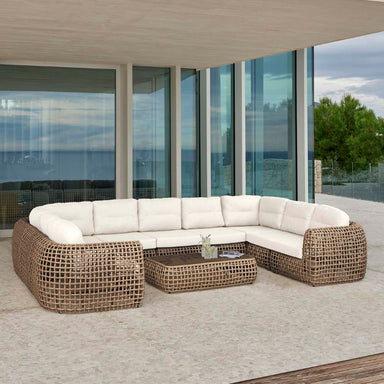 Outdoor patio furniture set with white cushions on a modern deck.