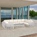 Modern outdoor sectional sofa on a patio with ocean view