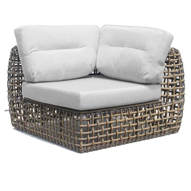 Wicker outdoor loveseat with white cushions on a white background