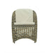 Wicker chair with a beige cushion on a white background