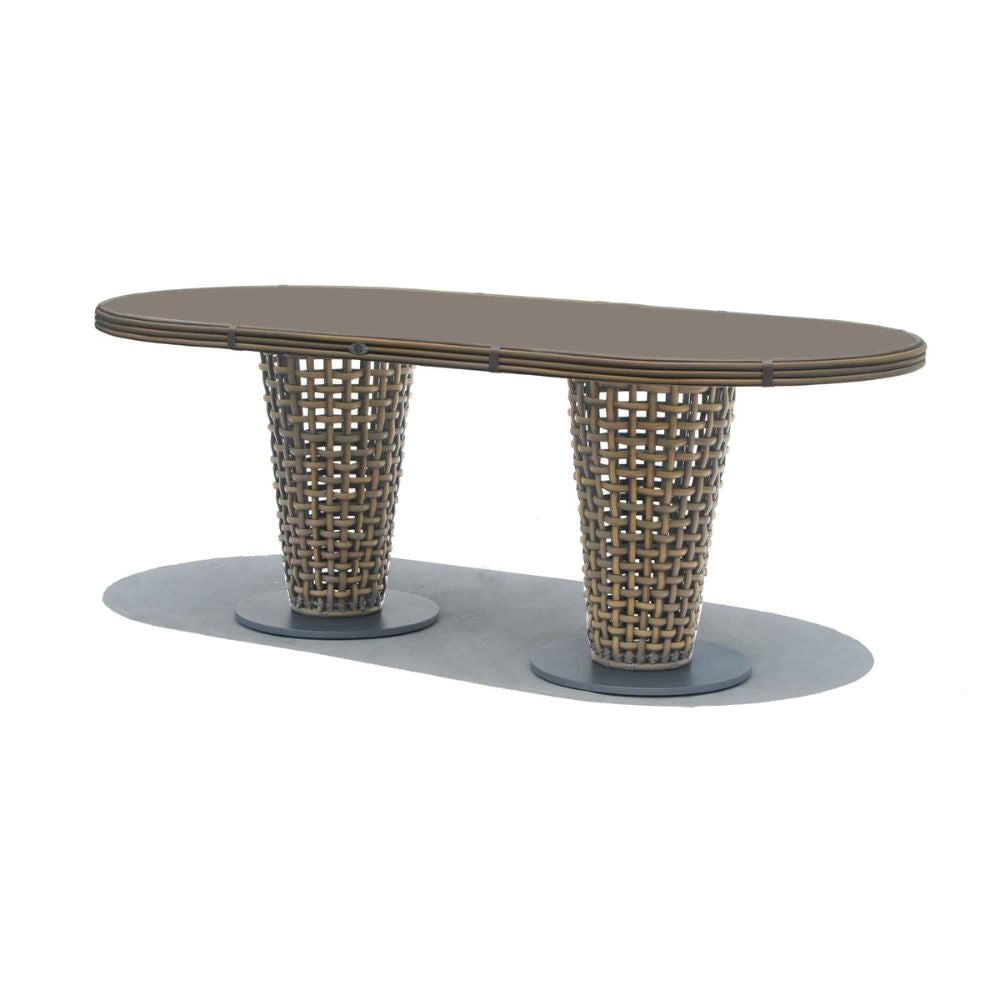 Oval table with wicker legs on a white background