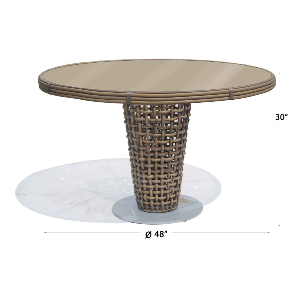 Round outdoor dining table with wicker base and dimensions on a white background
