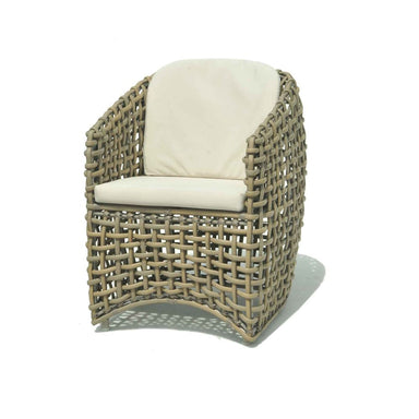 Woven chair with a white cushion on a white background