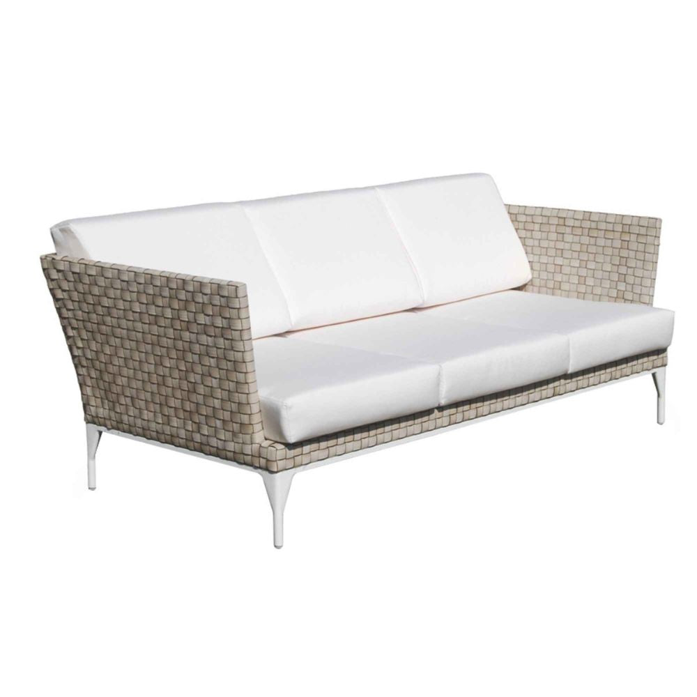 Outdoor sofa with wicker frame and white cushions on a white background