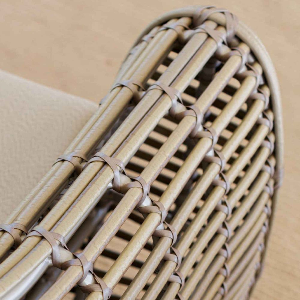 Close-up of a woven basket with a beige background