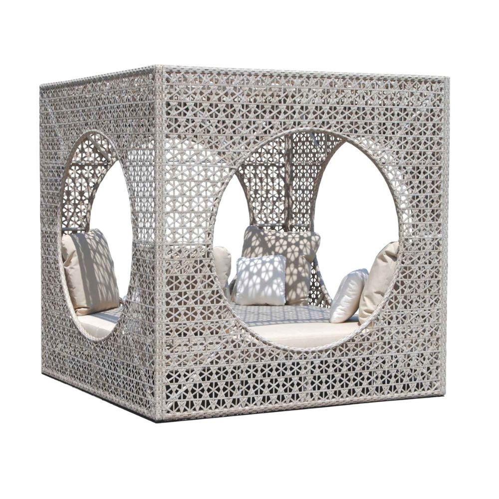 Decorative outdoor furniture with lattice design and cushions on a white background