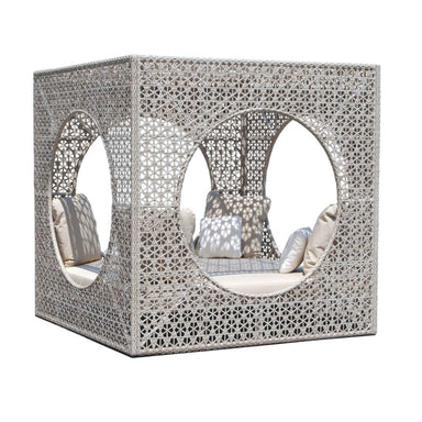 Decorative outdoor furniture with lattice design and cushions on a white background