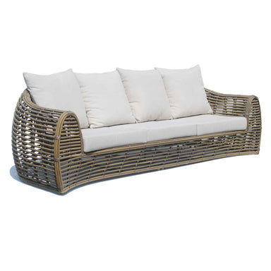 Wicker outdoor sofa with white cushions on a white background