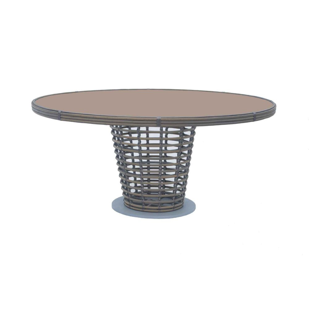 Round outdoor table with wicker base on a white background
