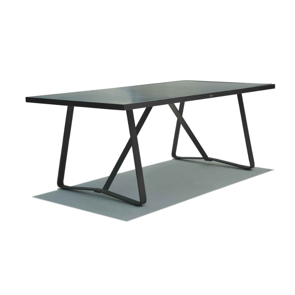 Modern dining table with black metal legs on a white background