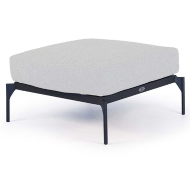 Modern ottoman with a white cushion and black metal frame on a white background