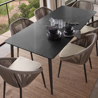 Dining table set with chairs on a patio