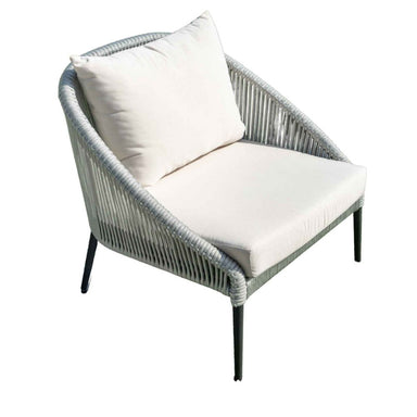 Wicker chair with white cushions on a white background