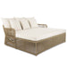 Wicker outdoor daybed with white cushions on a white background