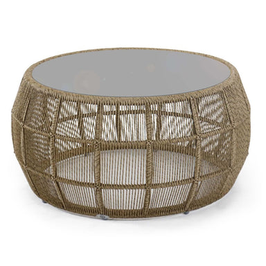 Round woven coffee table with a glass top on a white background