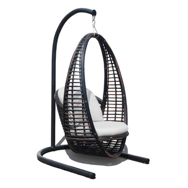 Black wicker hanging chair with white cushion on a white background