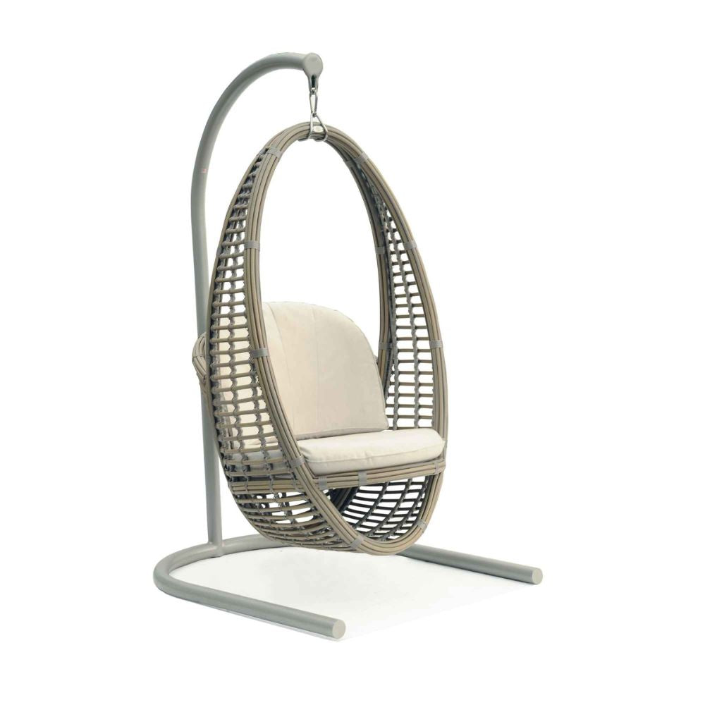 Hanging chair with beige cushion on a white background