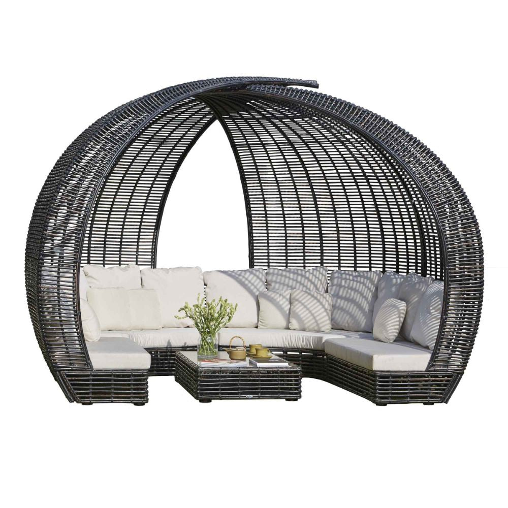Wicker outdoor furniture set with cushions on a white background