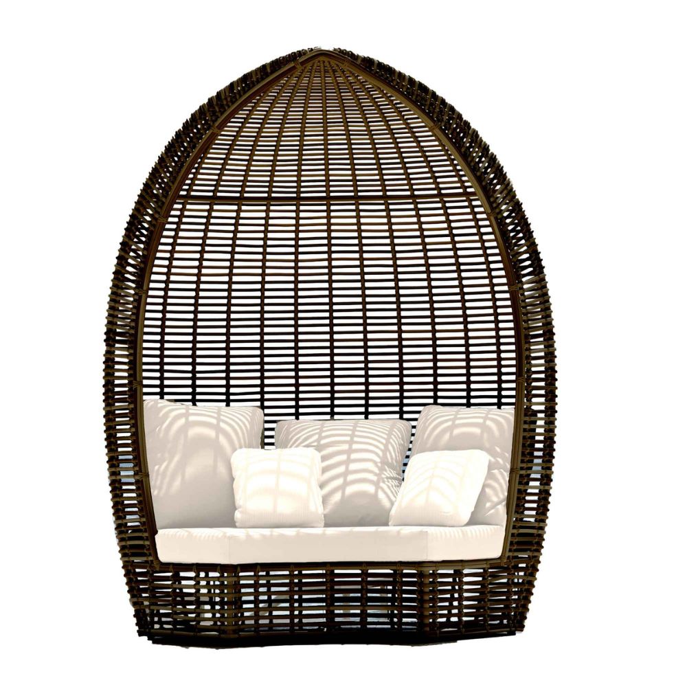 Wicker egg-shaped chair with white cushions on a white background