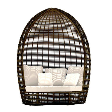 Wicker egg-shaped chair with white cushions on a white background