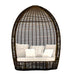 Wicker egg-shaped chair with white cushions on a white background