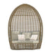 Wicker egg-shaped chair with cushions on a white background