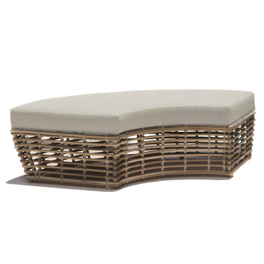 Wicker outdoor ottoman with a beige cushion on a white background