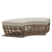 Wicker outdoor ottoman with a beige cushion on a white background