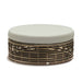 Round ottoman with woven base and light gray cushion on a white background