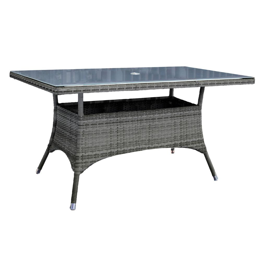 Rectangular outdoor table with wicker frame and glass top on a white background