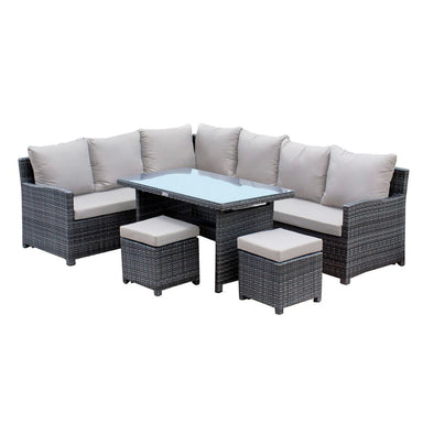 Outdoor furniture set with gray wicker chairs, table, and ottomans on a white background